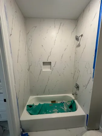 a view of a livingroom with a ceiling fan and window