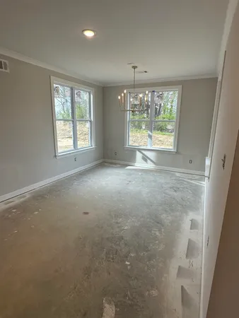 a kitchen with a sink and a mirror