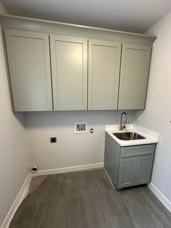 a white bath tub sitting in a bathroom