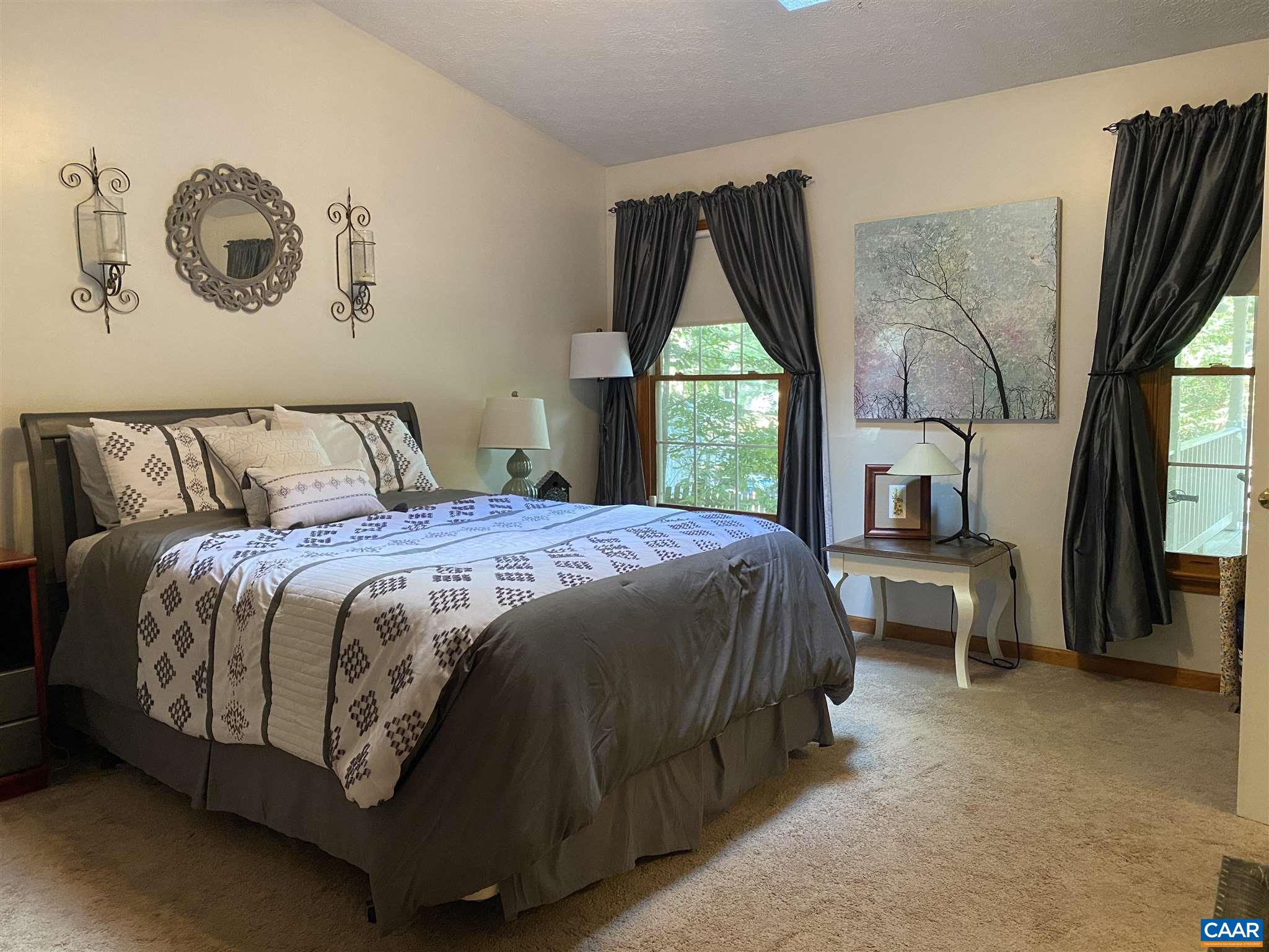 11 Stonefield Road Palmyra, VA 22963 - Photo 14 of 27 a bedroom with a bed and a large window