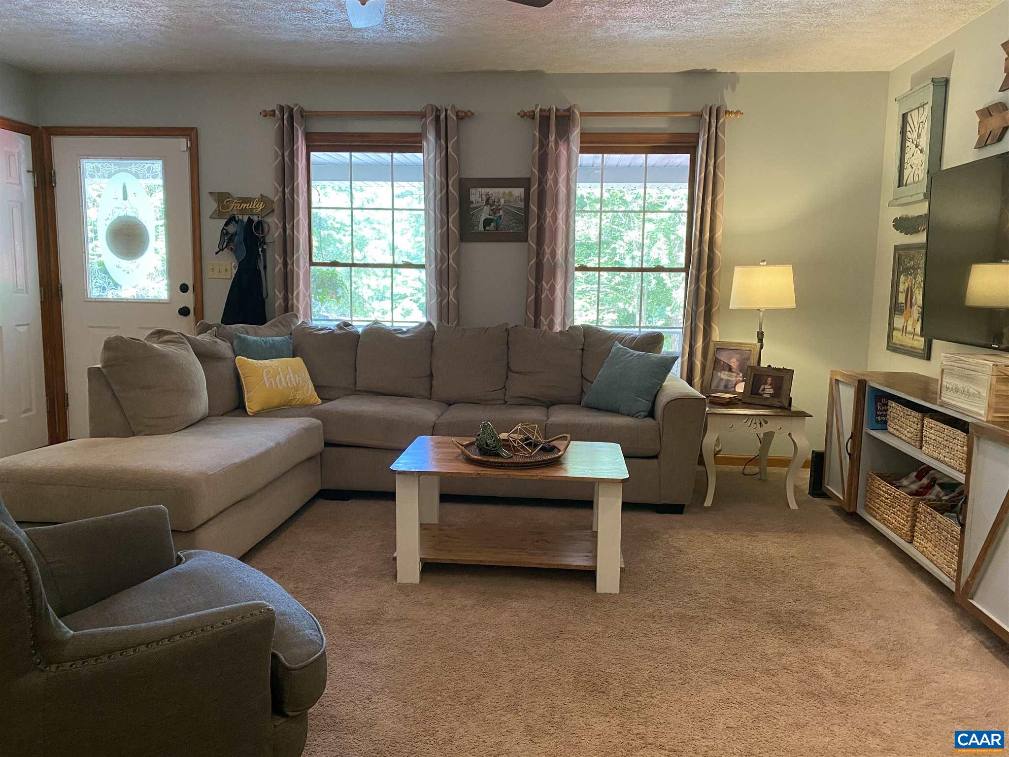 11 Stonefield Road Palmyra, VA 22963 - Photo 4 of 27 a living room with furniture and a flat screen tv
