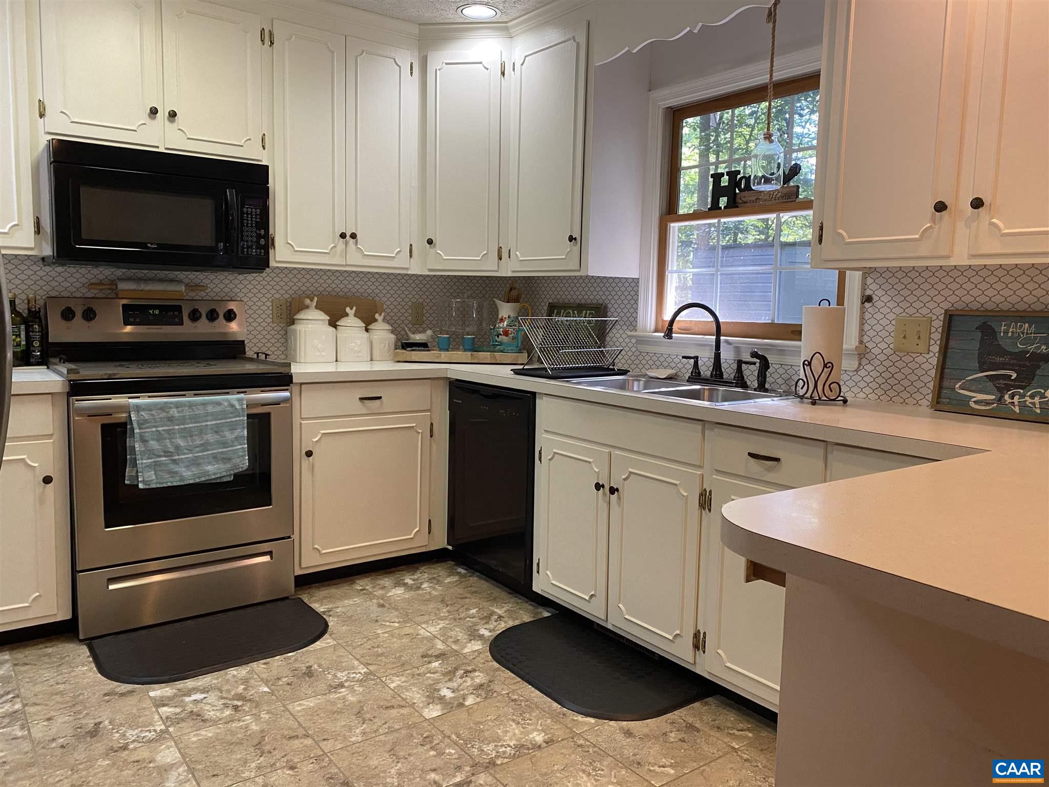 11 Stonefield Road Palmyra, VA 22963 - Photo 10 of 27 a kitchen with stainless steel appliances granite countertop a sink stove and cabinets