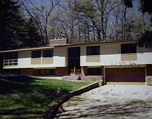 147 Maynard Road Sudbury, MA 01776 - Photo 1 of 1 a front view of a house with a yard