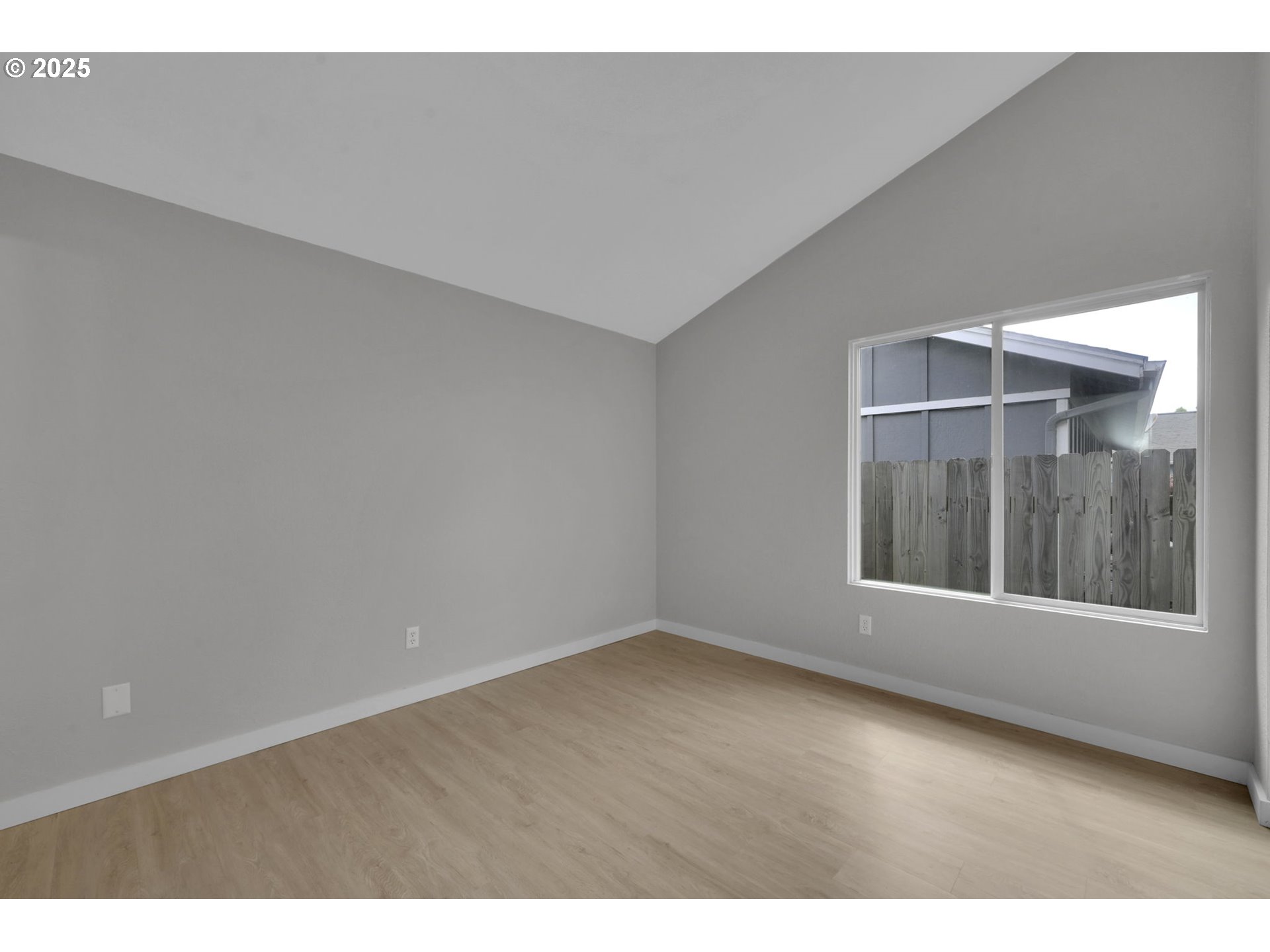 696 Island Street Springfield, OR 97477 - Photo 13 of 27 a view of an empty room with a window