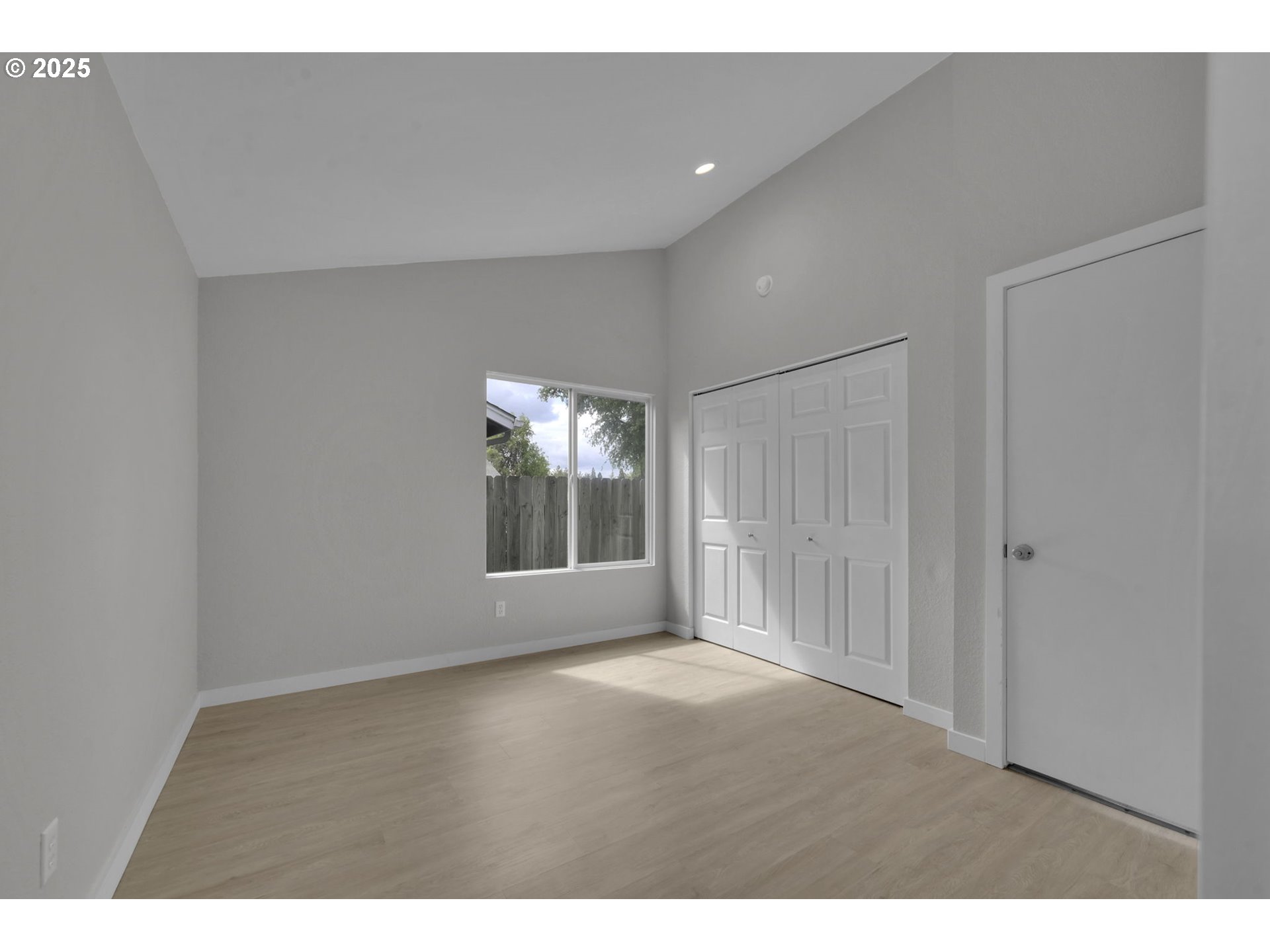 696 Island Street Springfield, OR 97477 - Photo 15 of 27 a view of an empty room with a window