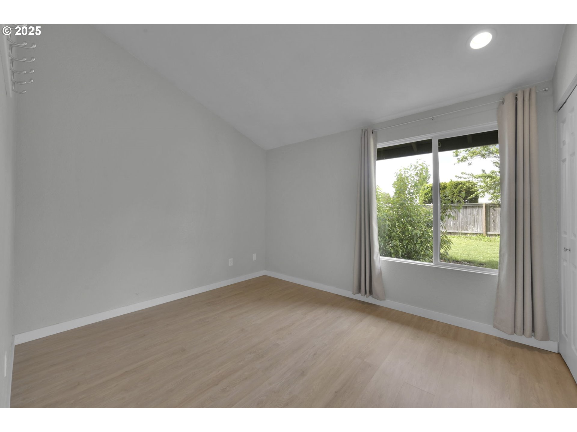 696 Island Street Springfield, OR 97477 - Photo 17 of 27 a view of an empty room with a window