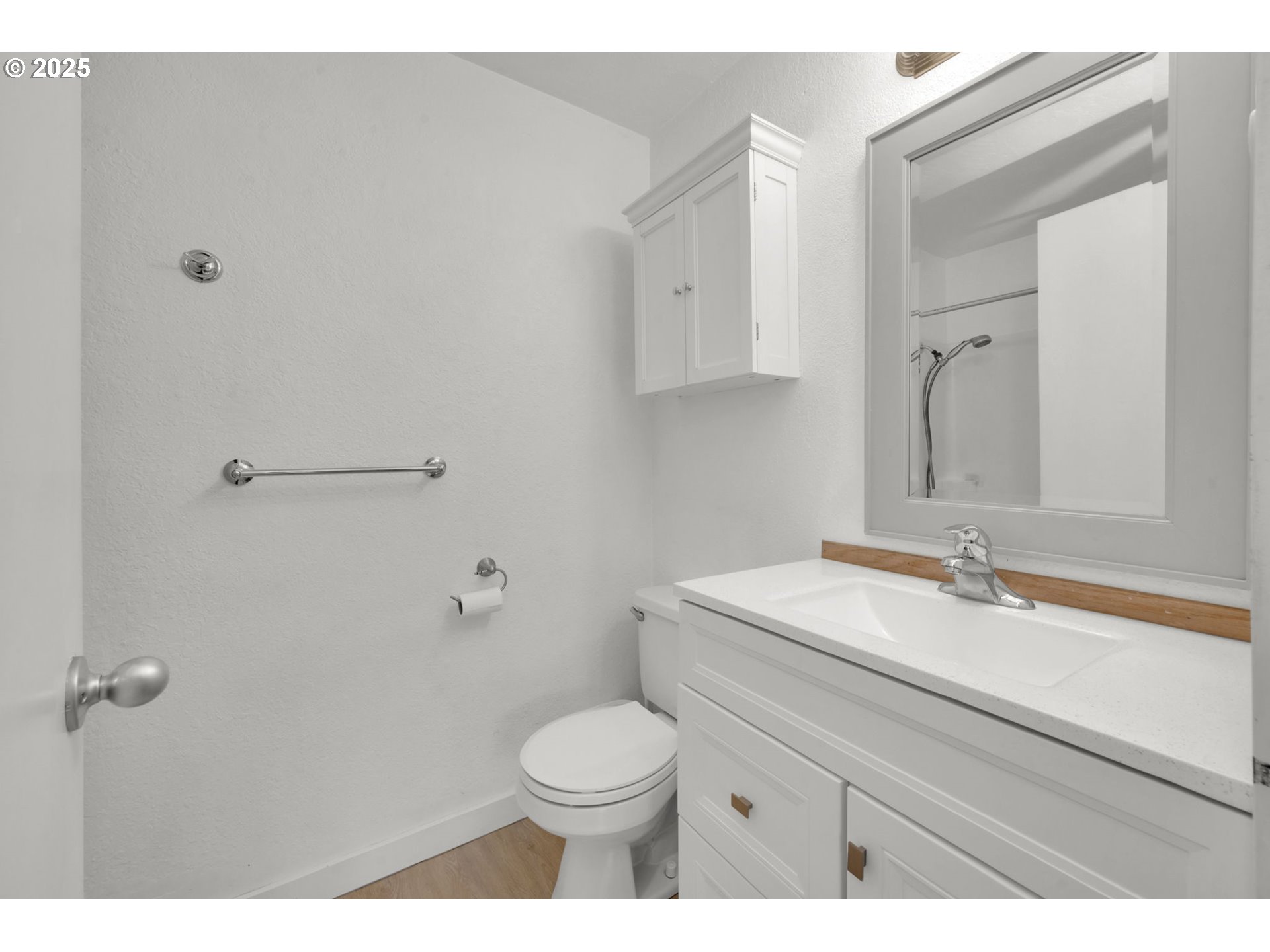 696 Island Street Springfield, OR 97477 - Photo 19 of 27 a bathroom with a sink toilet and vanity