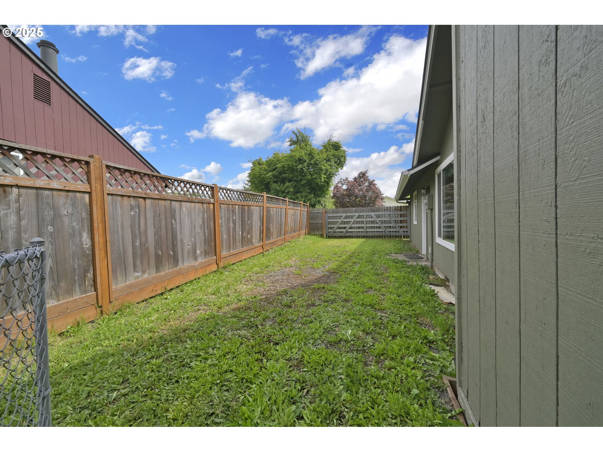 696 Island Street Springfield, OR 97477 - Photo 23 of 27 a view of backyard with garden and trees