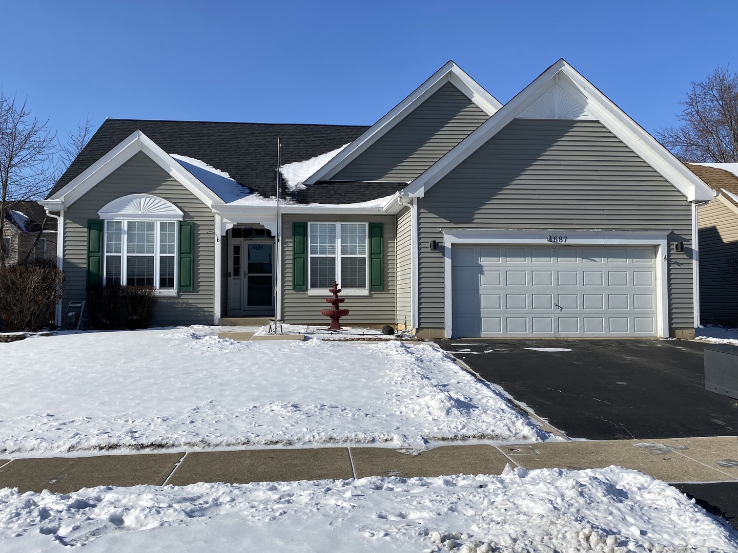 1687 Kautz Road Aurora, IL 60504 - Photo 1 of 23 a front view of a house with a yard and garage