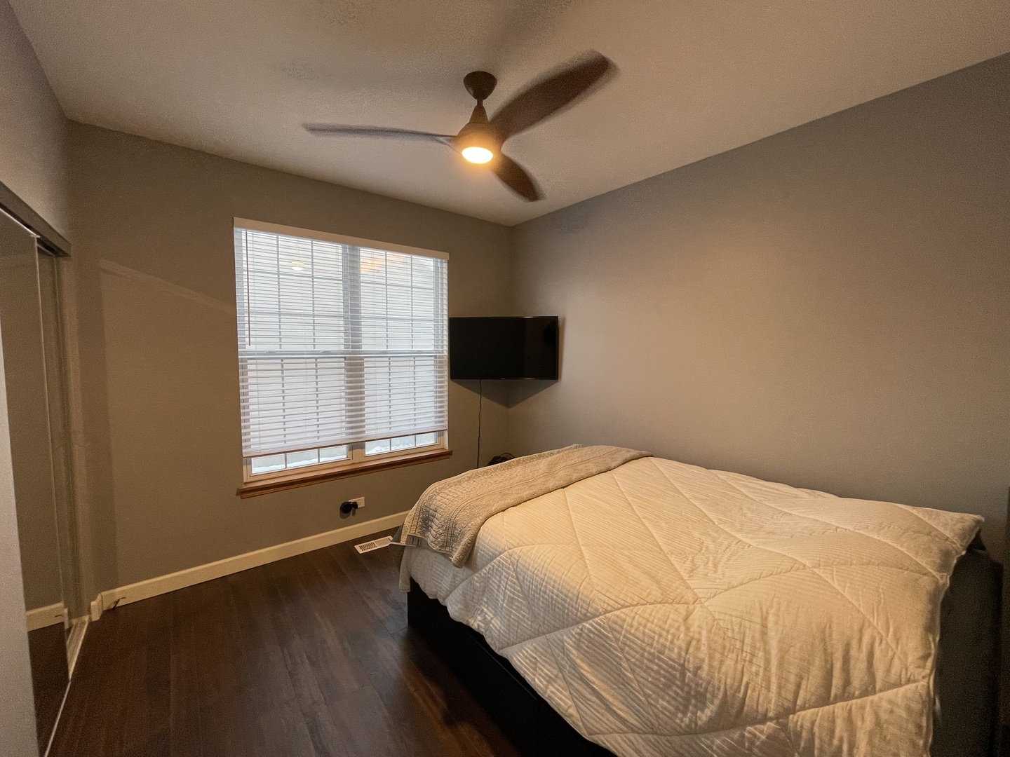 1687 Kautz Road Aurora, IL 60504 - Photo 16 of 23 a bed sitting in a spacious bedroom next to a window
