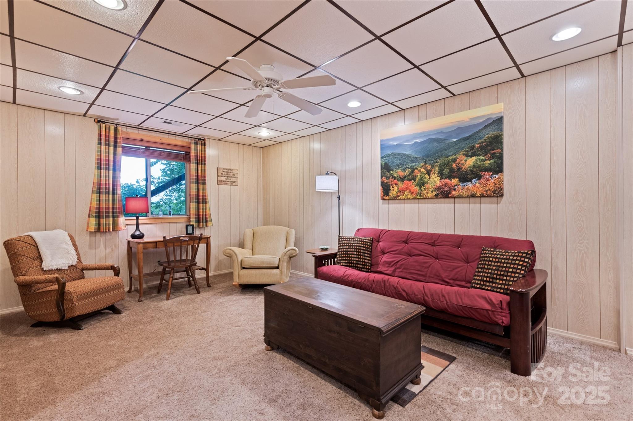 4231 Bald Creek Road Clyde, NC 28721 - Photo 12 of 23 a living room with furniture a couch and a ceiling fan