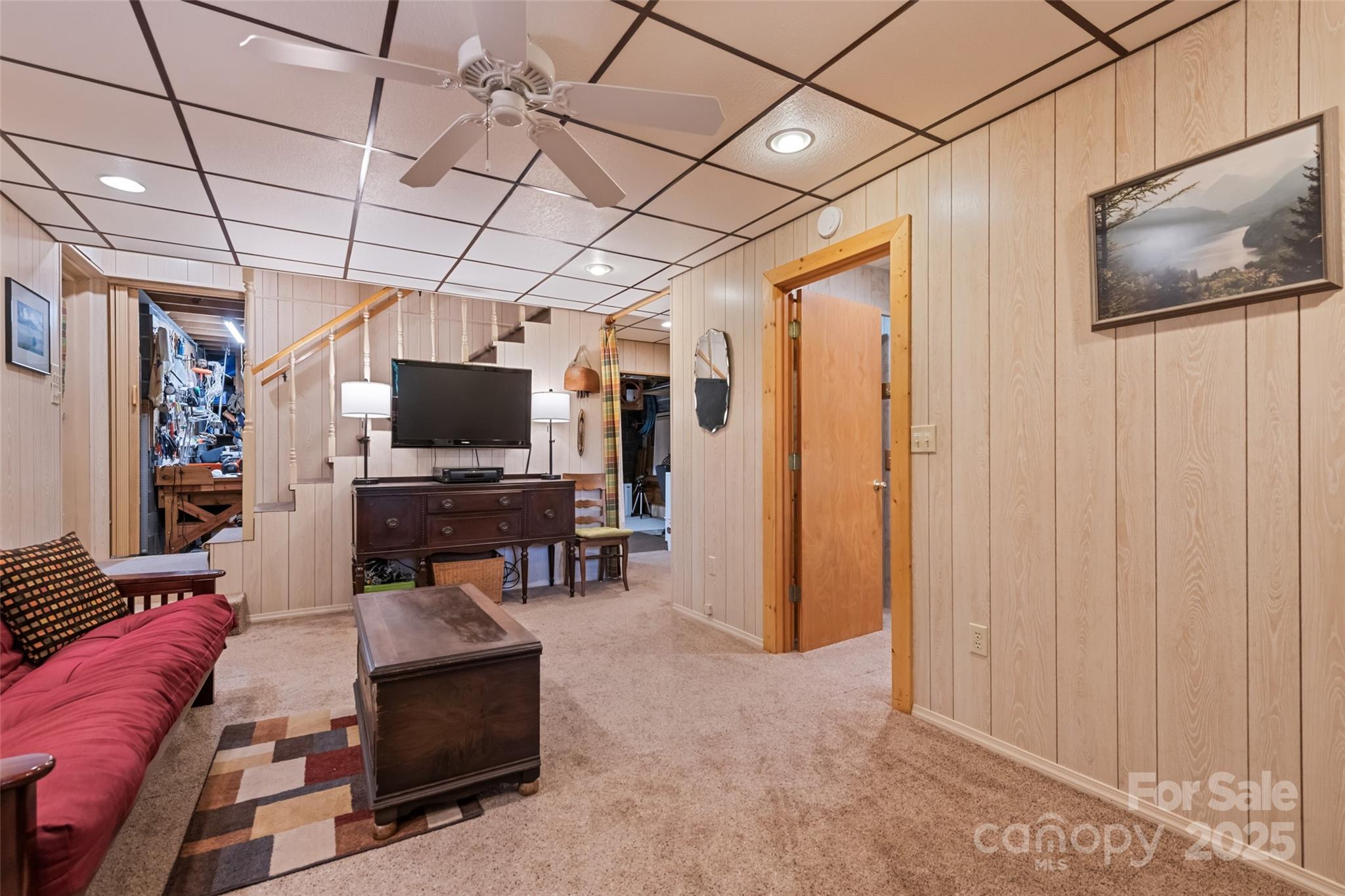 4231 Bald Creek Road Clyde, NC 28721 - Photo 13 of 23 a living room with furniture and a flat screen tv