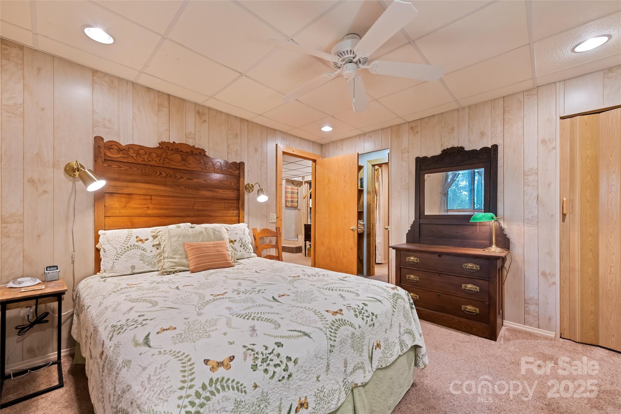 4231 Bald Creek Road Clyde, NC 28721 - Photo 15 of 23 a bedroom with a bed and a dresser