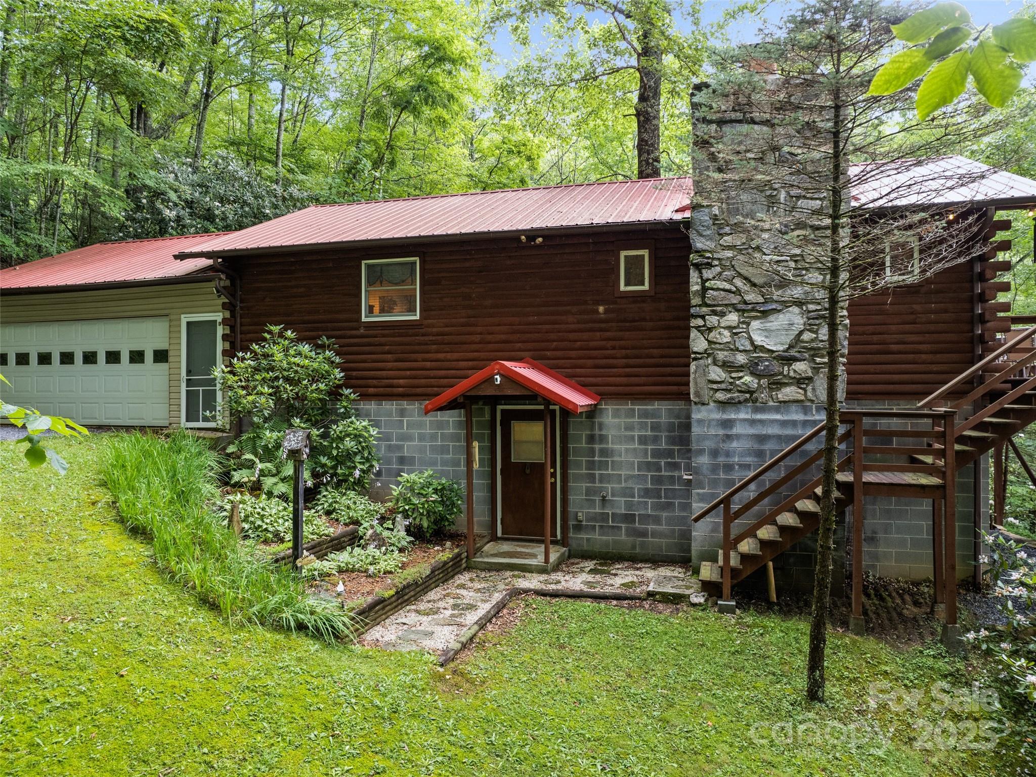 4231 Bald Creek Road Clyde, NC 28721 - Photo 23 of 23 a front view of a house with a yard