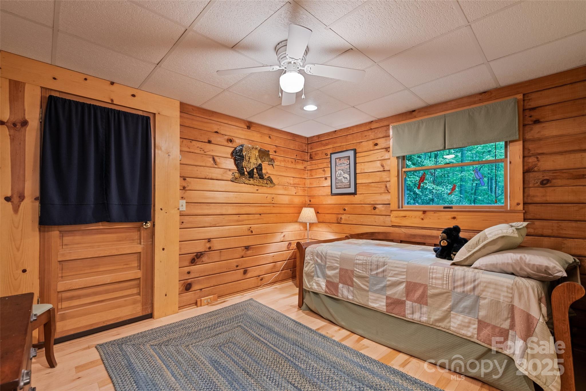 4231 Bald Creek Road Clyde, NC 28721 - Photo 9 of 23 a bedroom with a bed and a window