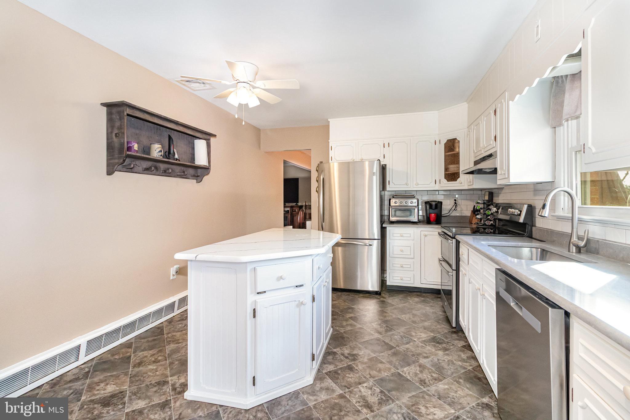 12 Shady Road Camp Hill, PA 17011 - Photo 11 of 32 a kitchen with a sink stove and refrigerator