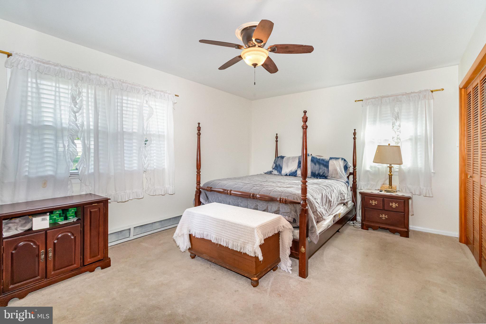 12 Shady Road Camp Hill, PA 17011 - Photo 16 of 32 a bedroom with a bed and a chandelier