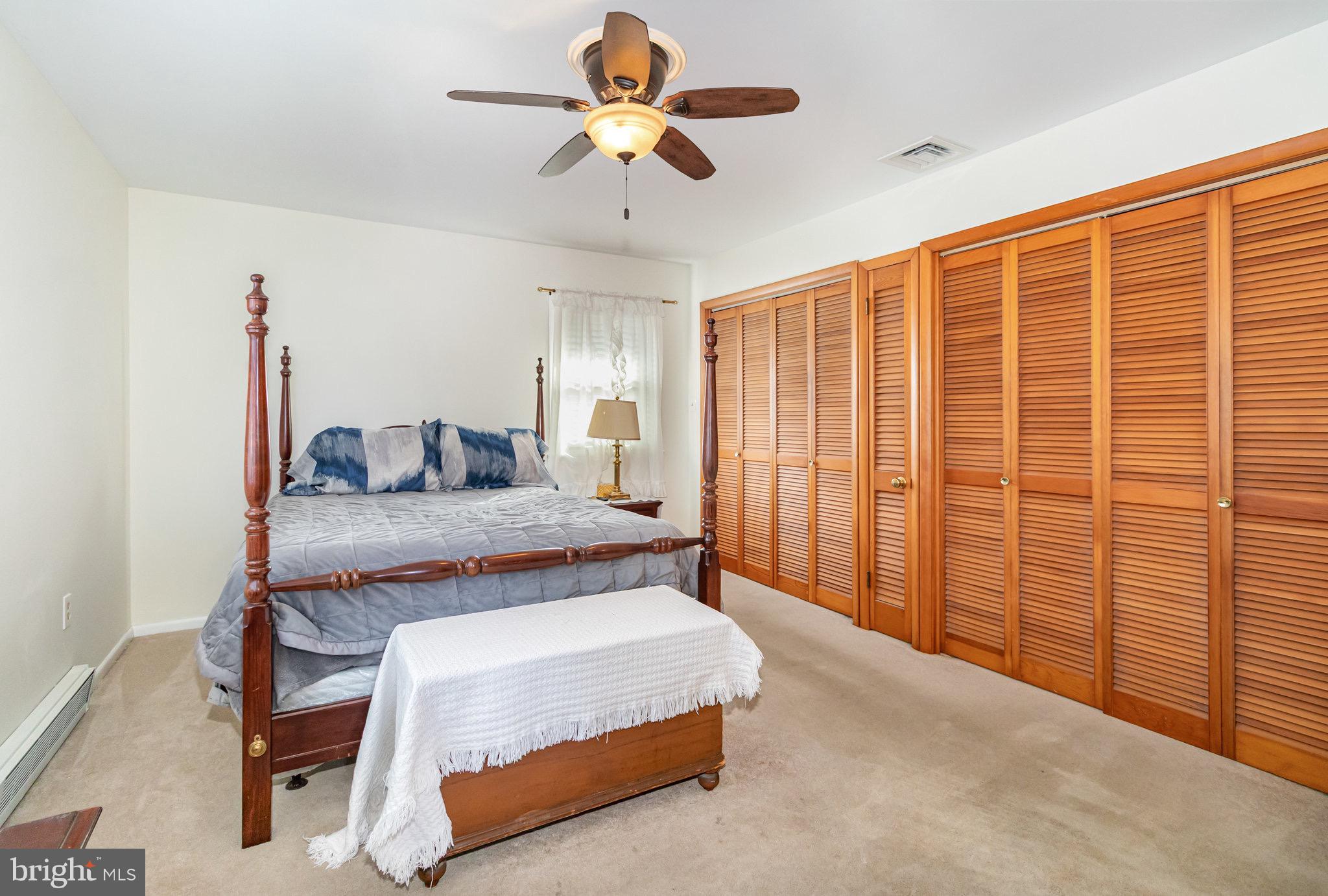 12 Shady Road Camp Hill, PA 17011 - Photo 18 of 32 a bedroom with a bed and a chandelier