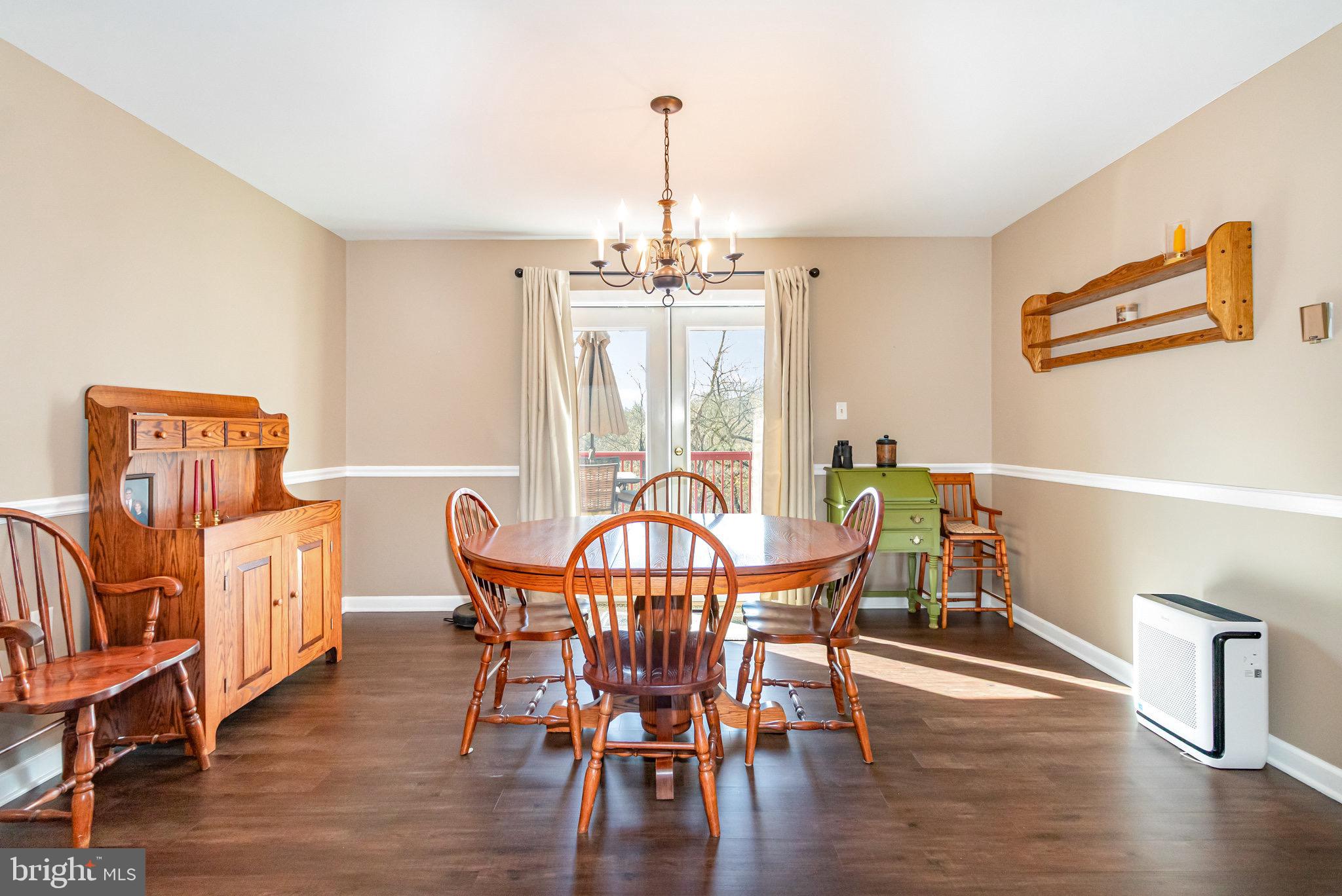 12 Shady Road Camp Hill, PA 17011 - Photo 9 of 32 a view of a dining room with furniture window and wooden floor