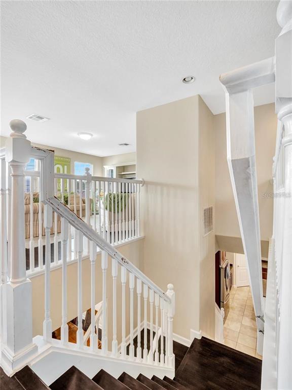 10023 Ians Ridge Road Orlando, FL 32832 - Photo 22 of 60 a view of entryway and hall with wooden floor
