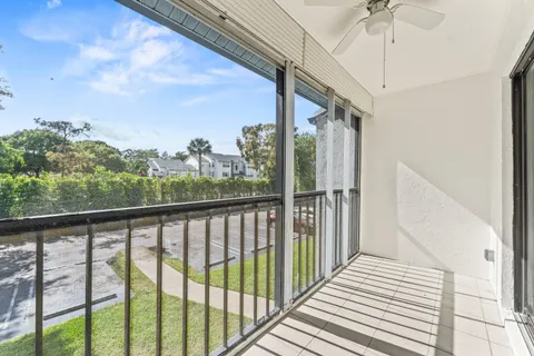 a view of a balcony with wooden floor