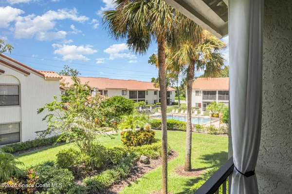swimming pool with outdoor seating and yard