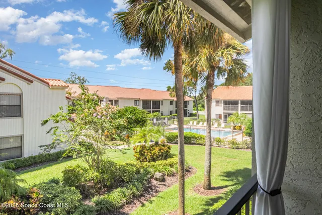 swimming pool with outdoor seating and yard