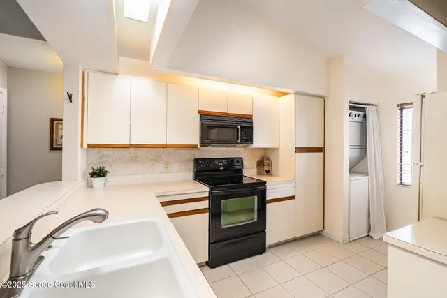 a kitchen with a sink stove and refrigerator