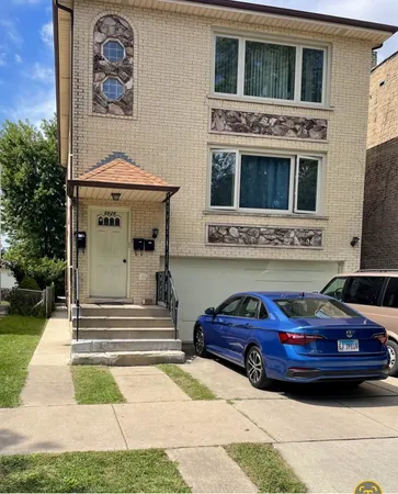 a front view of a house with parking space