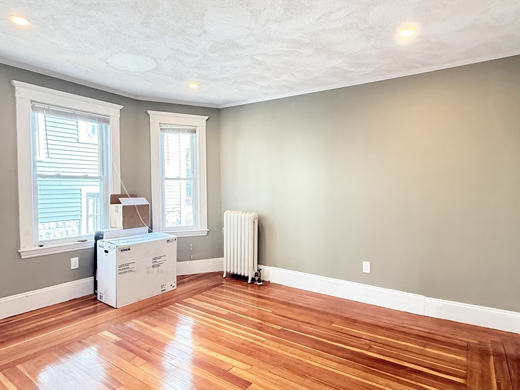 21 High Street, Unit 1 Somerville, MA 02144 - Photo 8 of 14 a view of a livingroom with a window