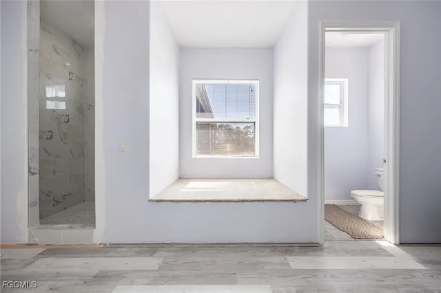 a view of an empty room and window