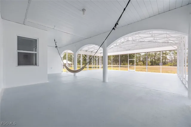 a view of an empty room with a large window