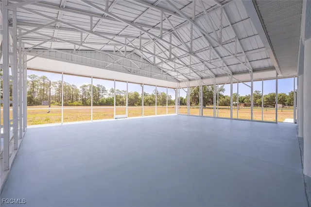 view of an empty room with a large window