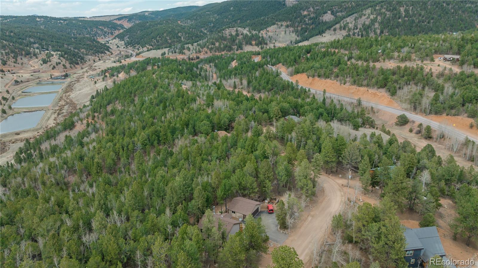 881 Timber Ridge Road Divide, CO 80814 - Photo 11 of 13 an aerial view of residential houses with outdoor space and trees