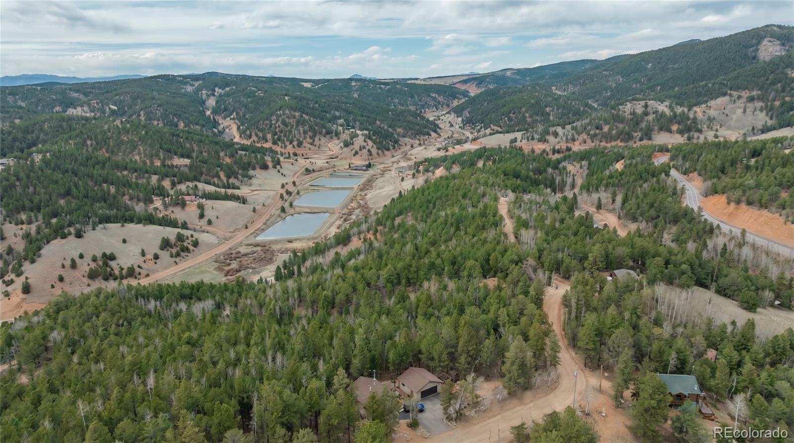 881 Timber Ridge Road Divide, CO 80814 - Photo 5 of 13 a view of a city with mountains in the background