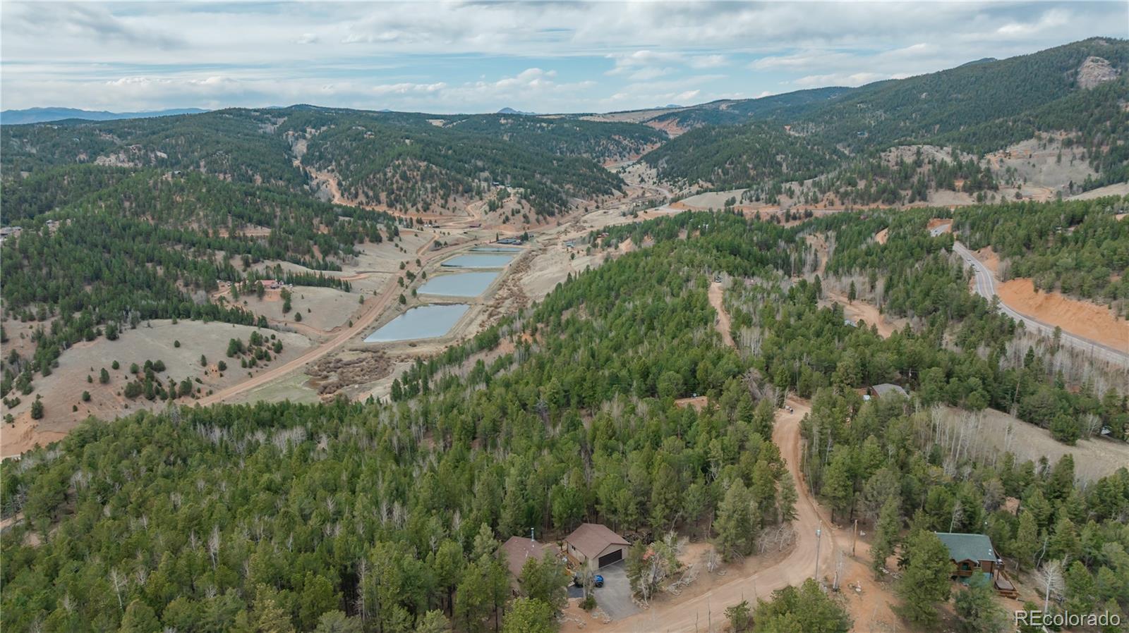 881 Timber Ridge Road Divide, CO 80814 - Photo 10 of 13 an aerial view of houses with yard