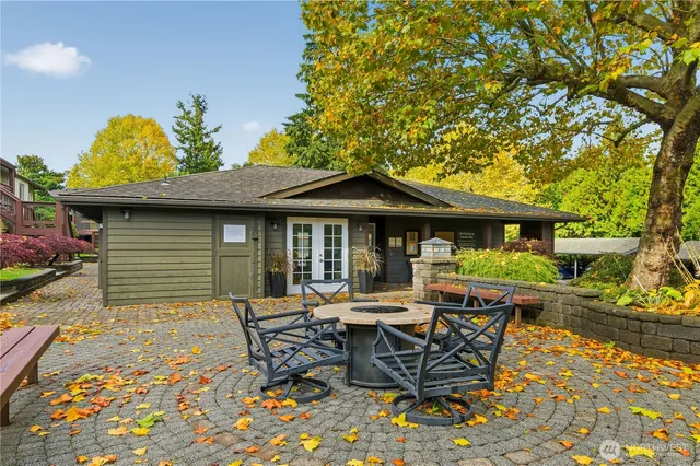 a view of a patio with table and chairs and potted plants