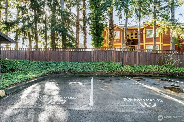 a view of a chair and table in the garden
