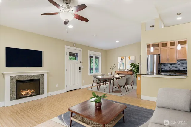 a living room with furniture fireplace and window