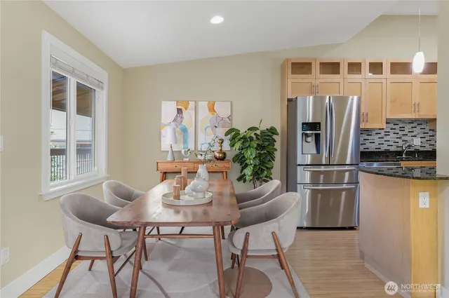 a dining room with furniture and window