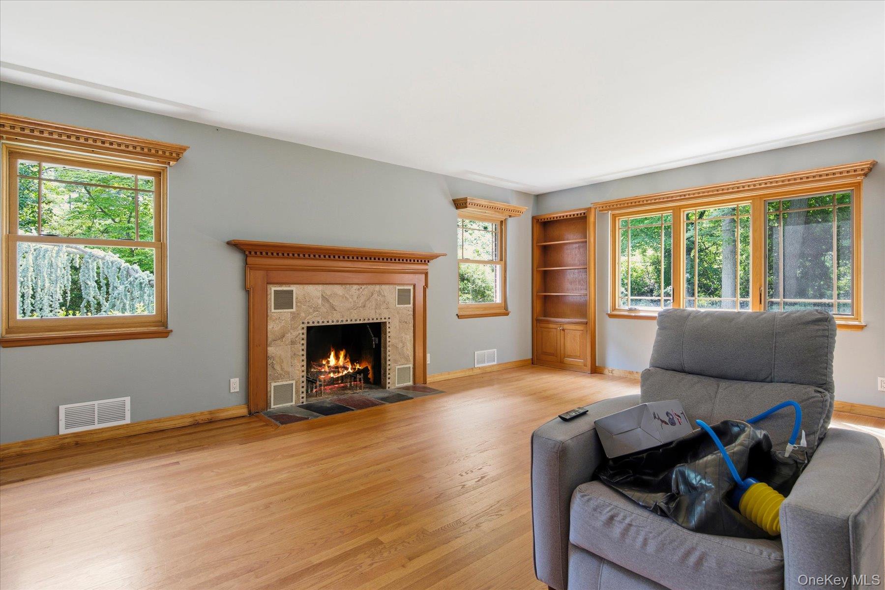 42 Cliff Road Port Jefferson, NY 11777 - Photo 6 of 22 a living room with furniture and a fireplace