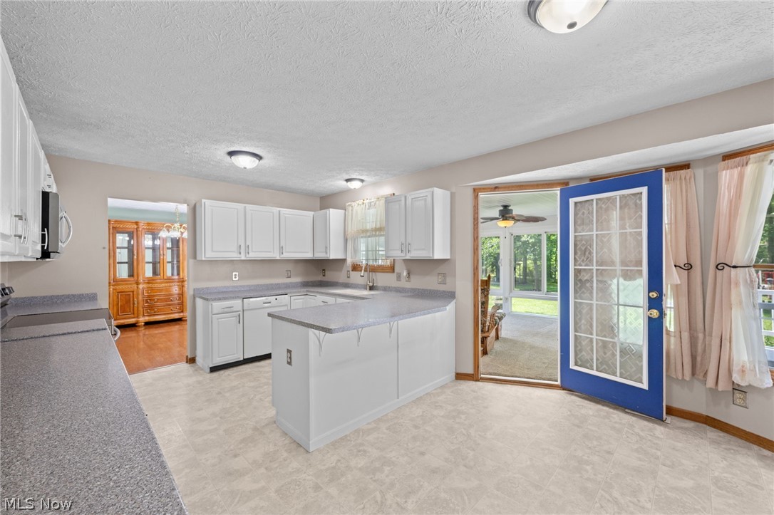 5100 McCormick Road Ravenna, OH 44266 - Photo 10 of 34 Four seasons Sun room opens directly off of the kitchen