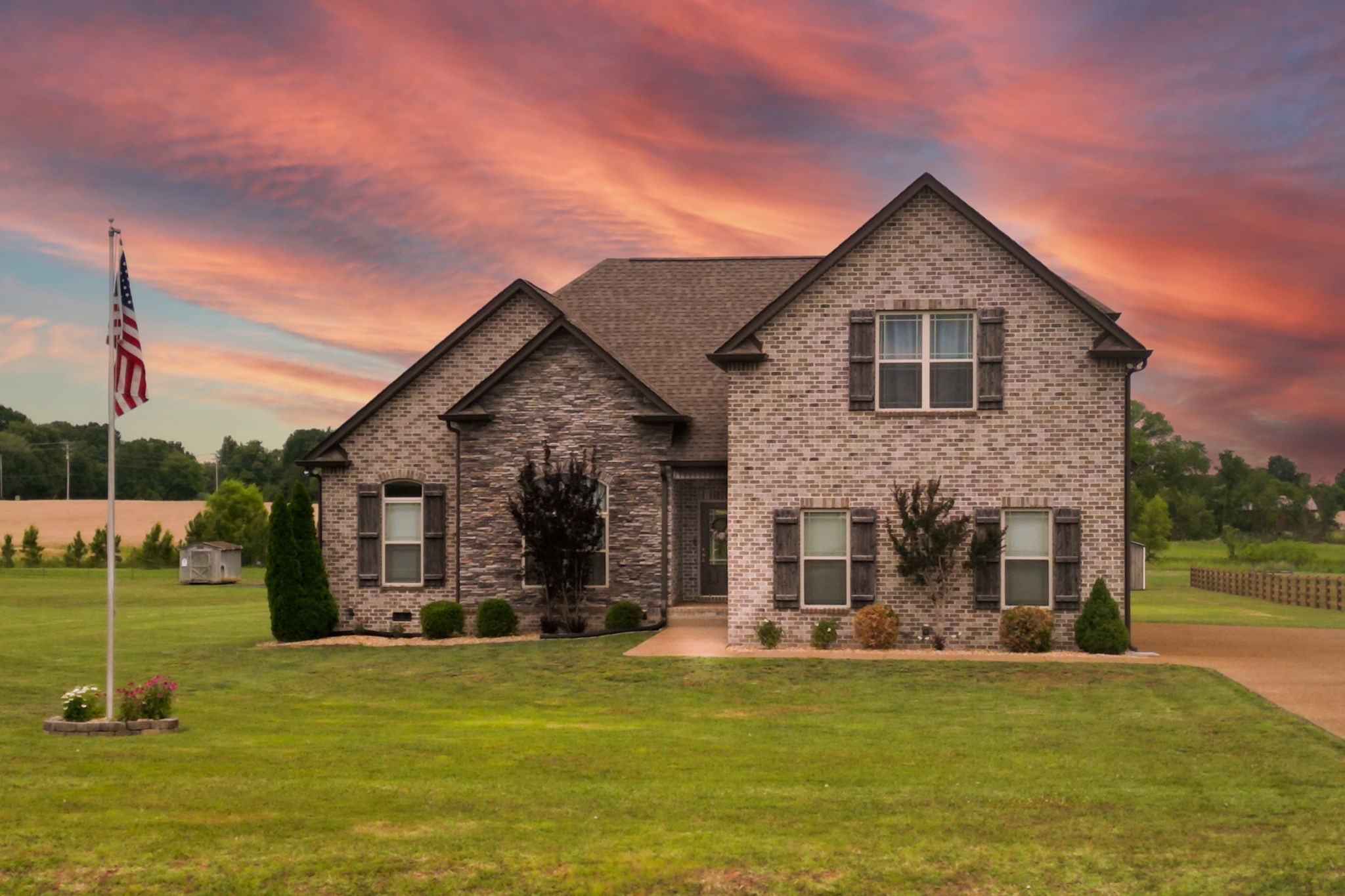 a front view of a house with a yard