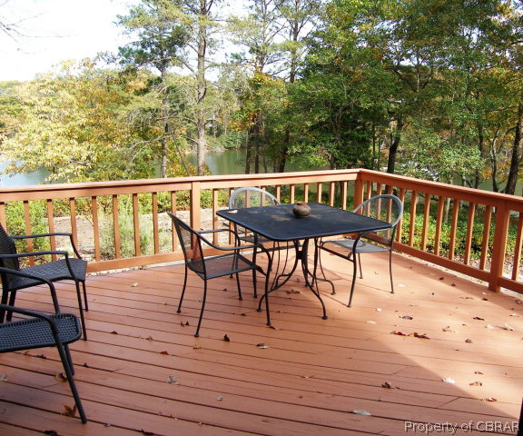 879 West Point Road Lancaster, VA 22503 - Photo 14 of 38 a view of a wooden deck with furniture