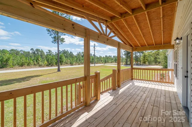 a view of a balcony with wooden floor