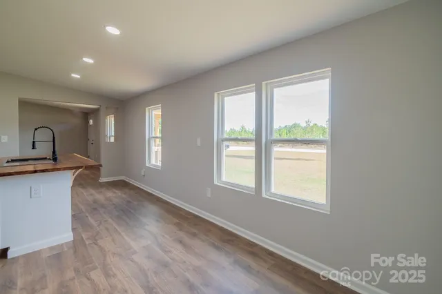 a view of a kitchen with a sink and a window