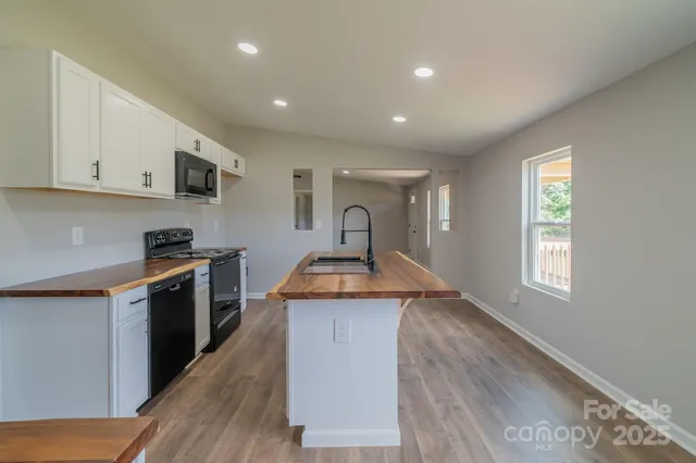 a kitchen with a stove and a sink