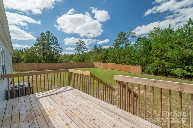 a view of balcony with wooden floor