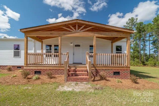 front view of a house with a small yard