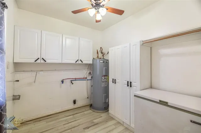 a bathroom with a shower and a sink